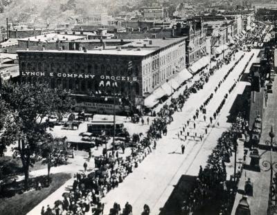 Durand Building Grocers Lynch & Co. Parade Looking east down Main St. near Jackson St. crossing.