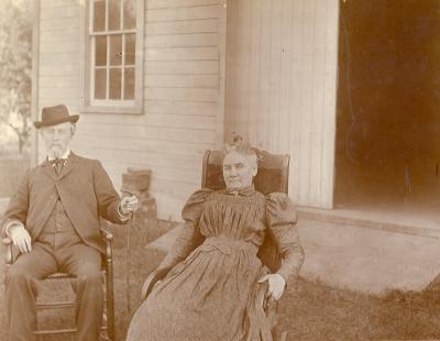 Unidentified Man and Woman Sitting Outside