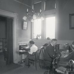 Unidentified man and woman, at work