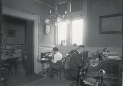 Unidentified man and woman, at work