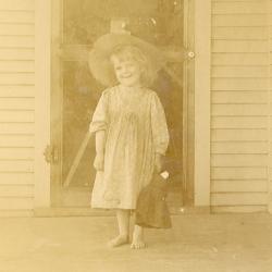 Unknown girl on a porch