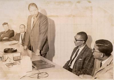 Men with slide projector