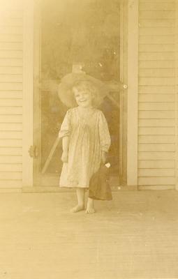 Unknown girl on a porch