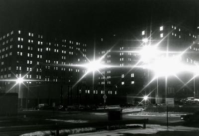 Night time photo of Consumers Power office building and Hayes Hotel from Pearl Street